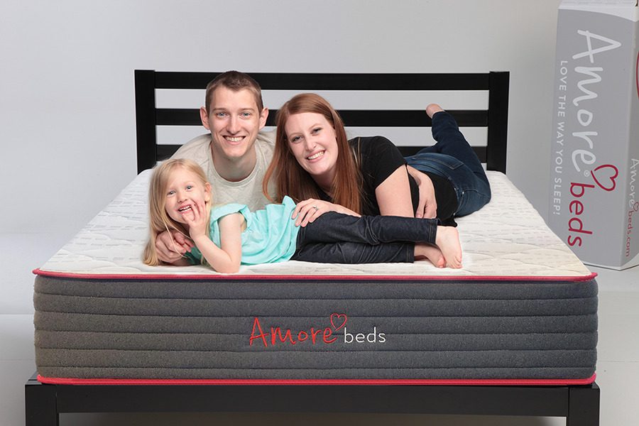 https://www.amorebeds.com/wp-content/uploads/2021/12/Hybrid-Flippable-Family-Laying.jpg
